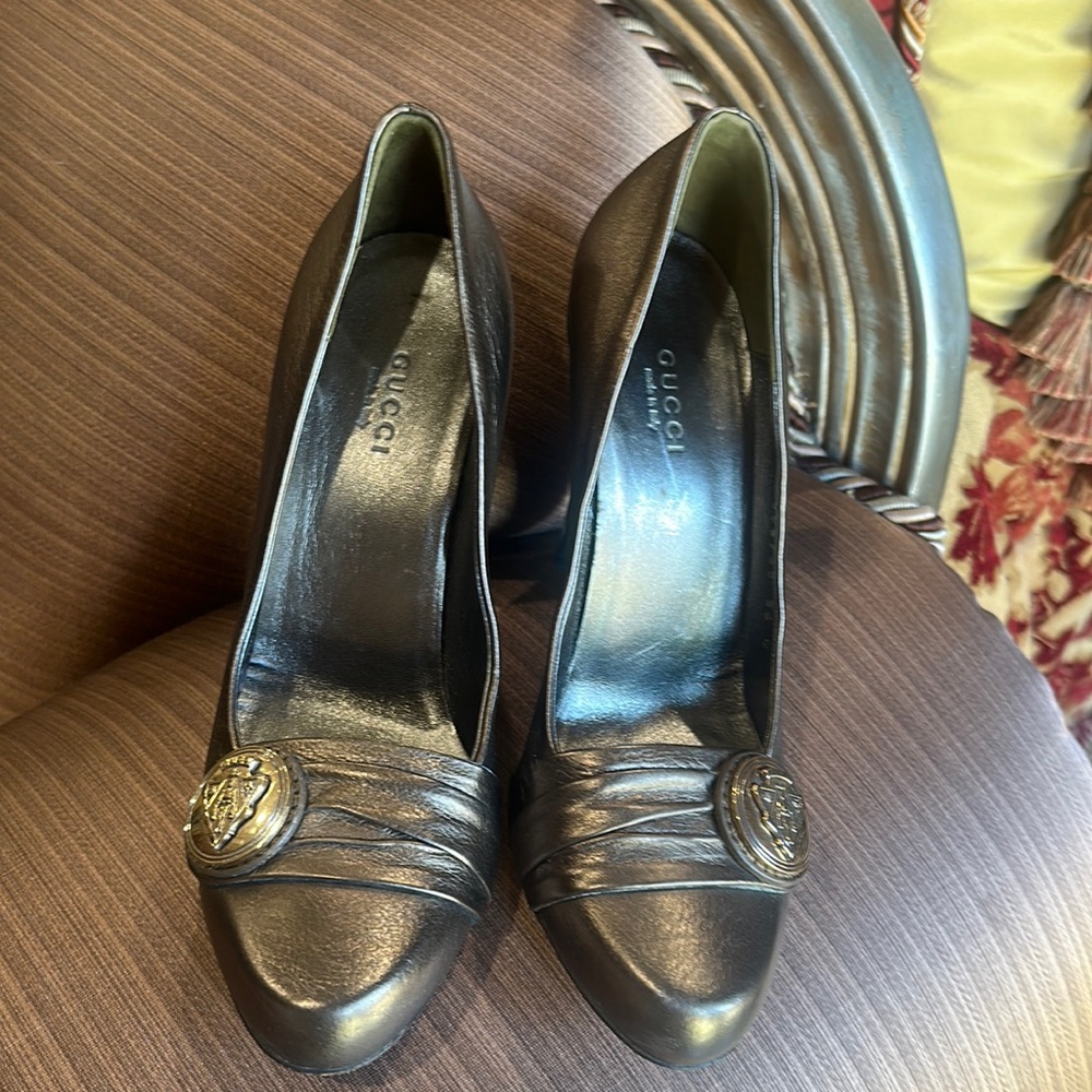 Gucci gorgeous dark gold “Hysteria” logo medallion heels. Super elegant.